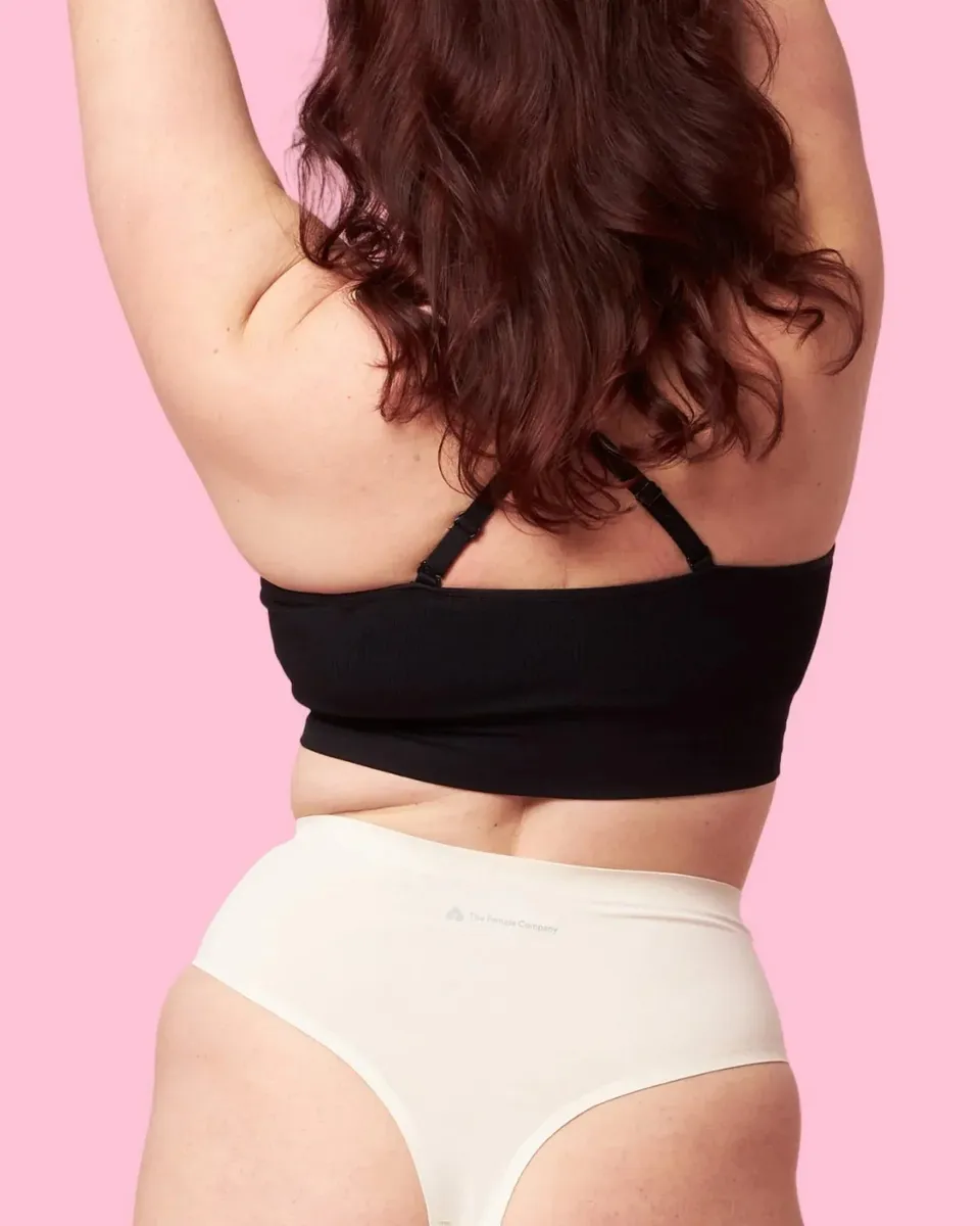 the-female-company-medium-high-waist-tanga-seamless-offwhite-period-panty-fluid- image 1
